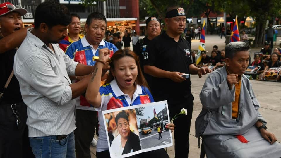 Tibet anguish visible in Chandigarh 200 Tibetans take to streets in black attire Lobga gave his life