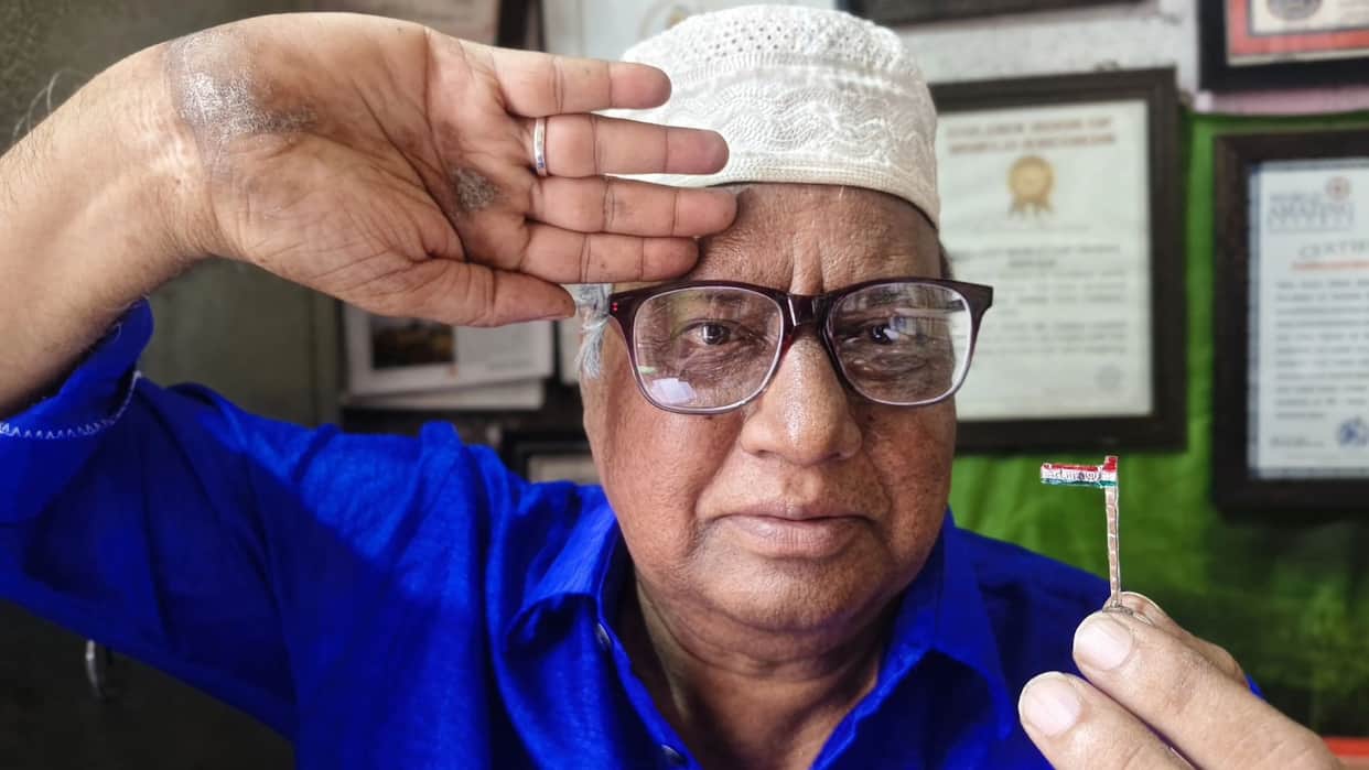 Om Allah Khanda and Cross on a 1 centimeter Tricolour Dr Iqbal Sakka conveys a message of communal harmony