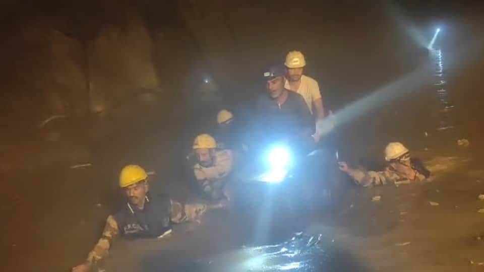 Chamoli Tunnel Landslide Half tunnel filled with water and debris up to neck level Soldiers rescue using drums