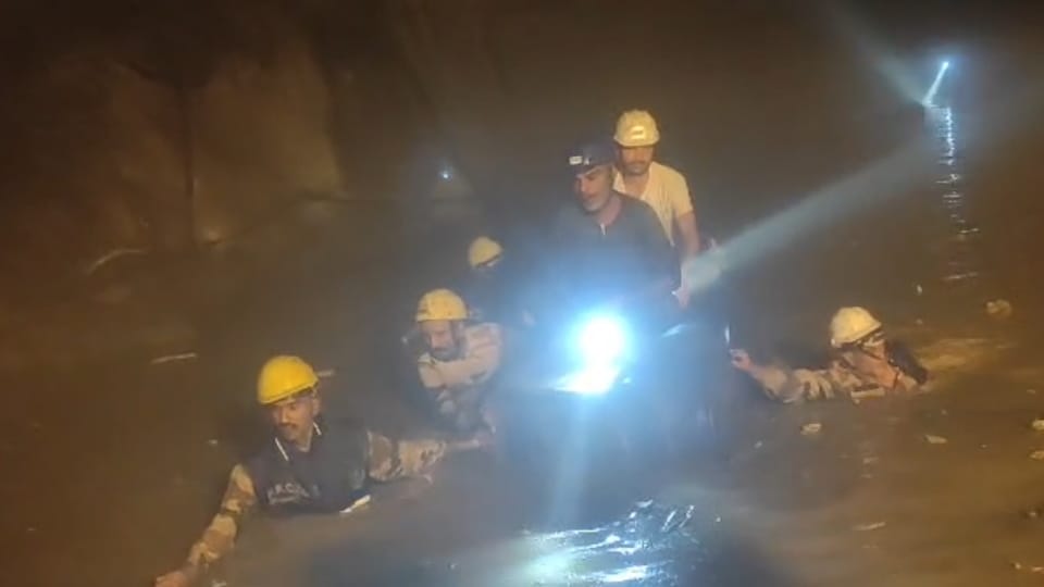 Chamoli Tunnel Landslide Half tunnel filled with water and debris up to neck level Soldiers rescue using drums