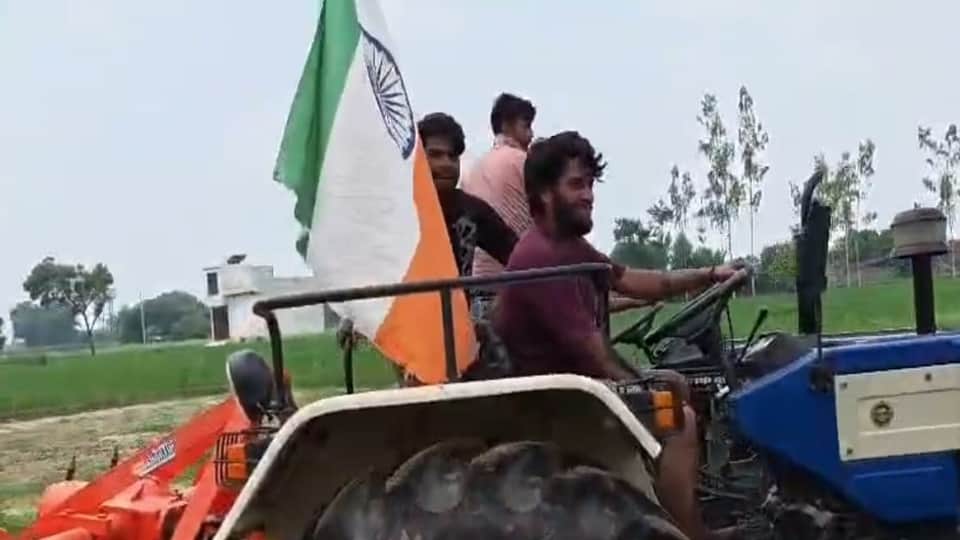 Upside down flag in tractor tiranga yatra