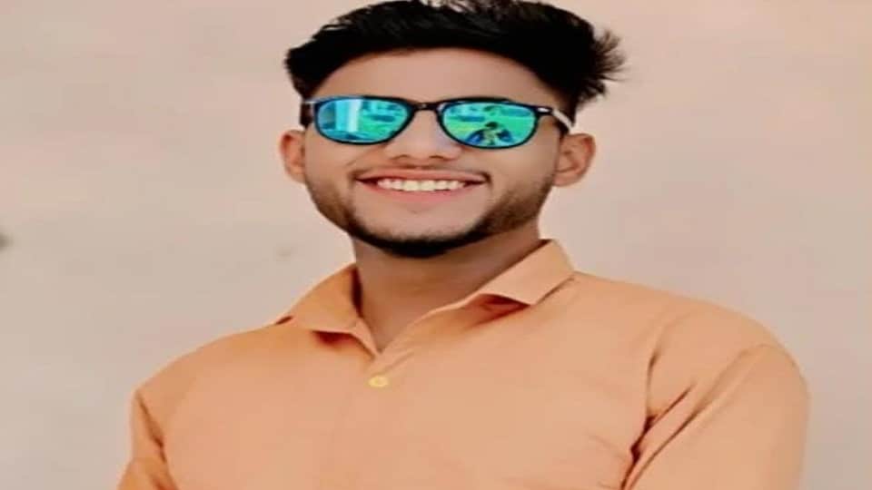 Body of college employee found hanging