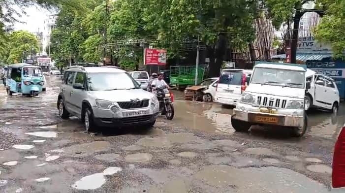 Kanpur Road near Namak Factory Crossing riddled with potholes waterlogging compounds difficulties