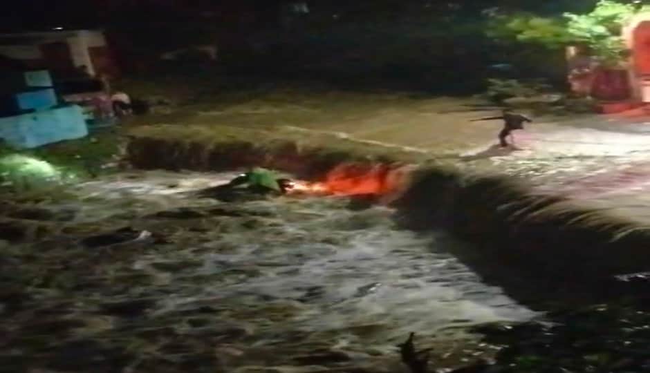 Bike swept away by strong current of Raksia Nala; rider has a narrow escape