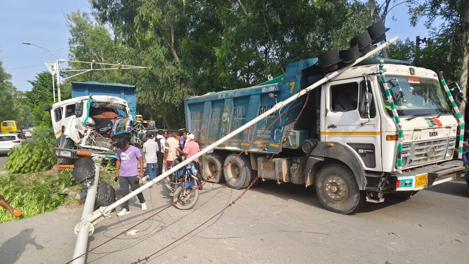 A speeding truck rammed into the rear of a truck stopped at a traffic light