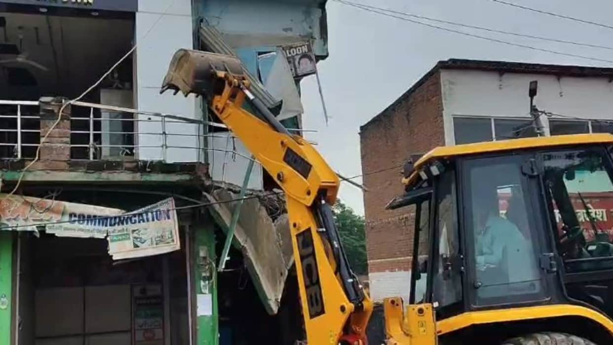 Bulldozer razes BSP leader Atif Khan two-story market complex 14 shops demolished in Budaun