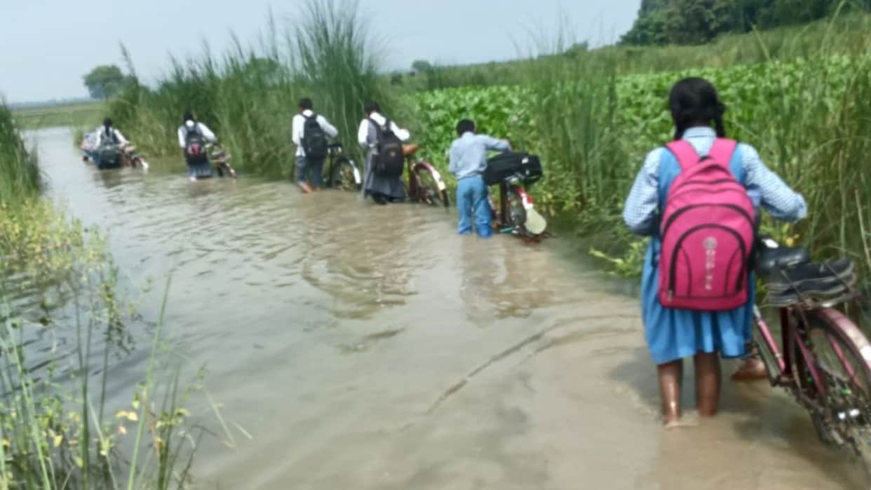 Perilous journey school Children through three feet water attend classes culvert washed away in Mahabal Purva