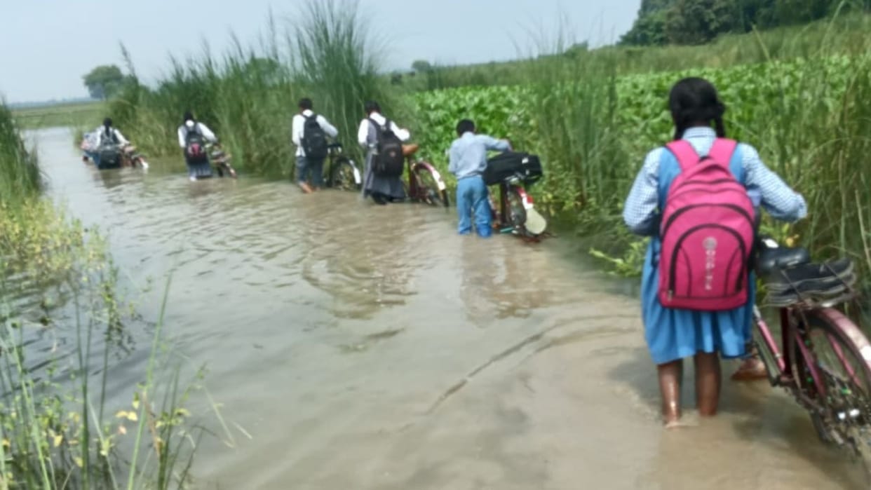 Perilous journey school Children through three feet water attend classes culvert washed away in Mahabal Purva