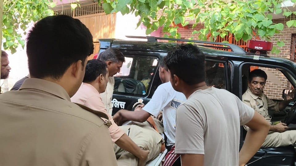 constable on motorcycle hit young man sitting at shop both have been admitted to hospital critical condition