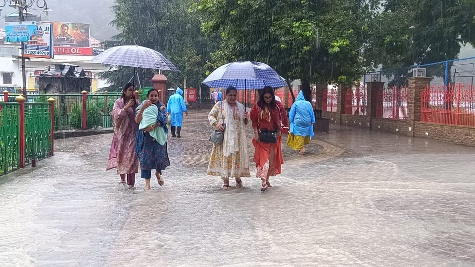 Waterlogging on Mall Road and DSA Ground in Nainital following rain; people facing inconvenience