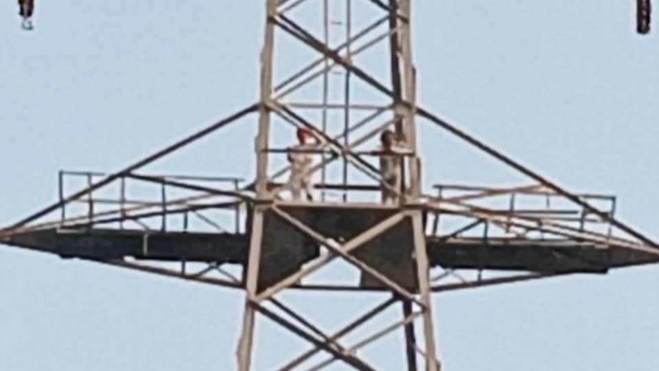 Pathankot Two elderly men climb 200-foot-high high-voltage tower