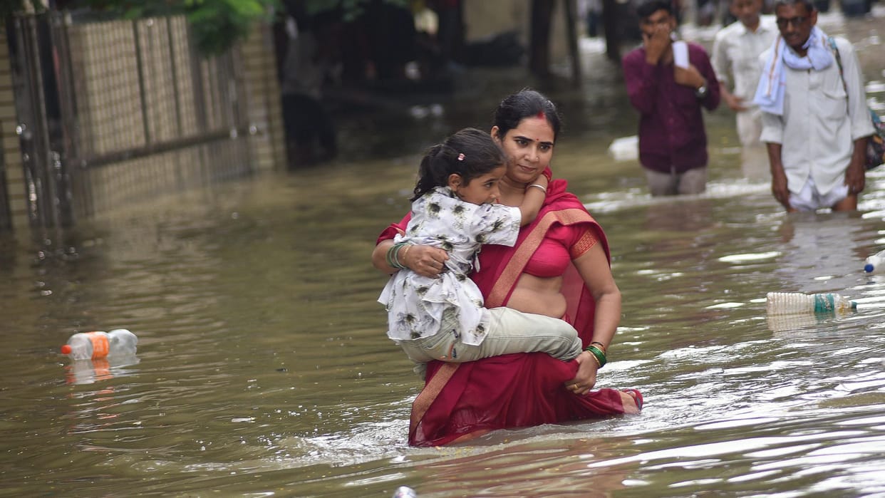 rain in Banaras latest photos of waterlogging in homes shops and at railway station airport