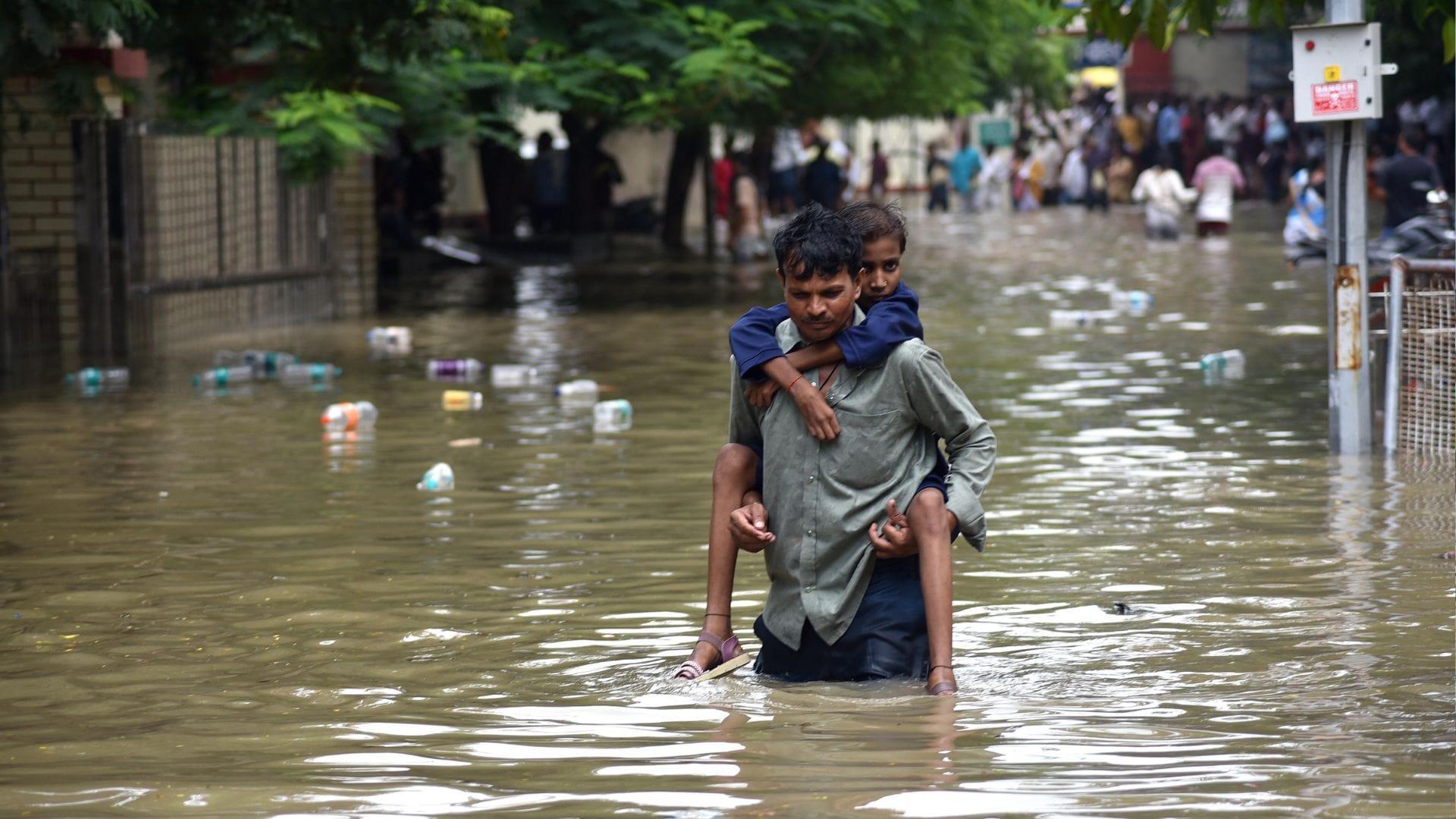 rain in Banaras latest photos of waterlogging in homes shops and at railway station airport