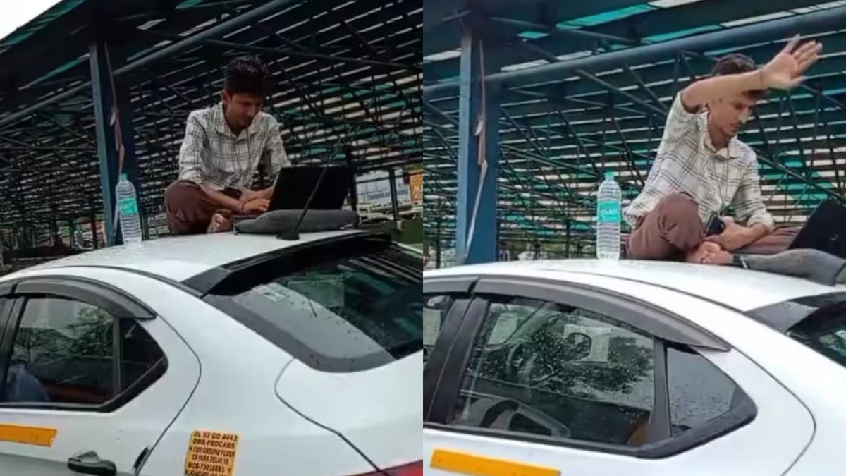 बारिश में लगा भयंकर जाम तो कार की छत पर बैठ गया शख्स, लैपटॉप खोलकर करने लगा ऑफिस का काम