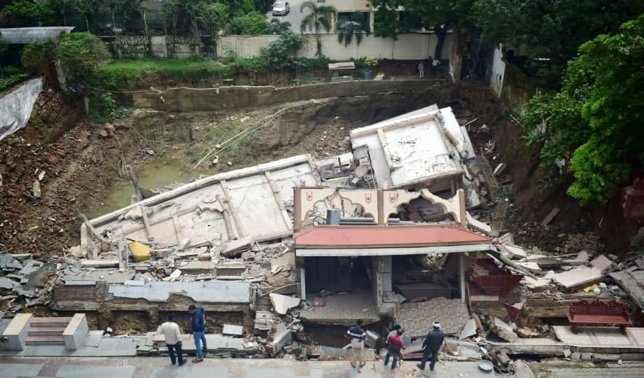Temple wall collapses during basement excavation; FIR registered against hotel owner and others.