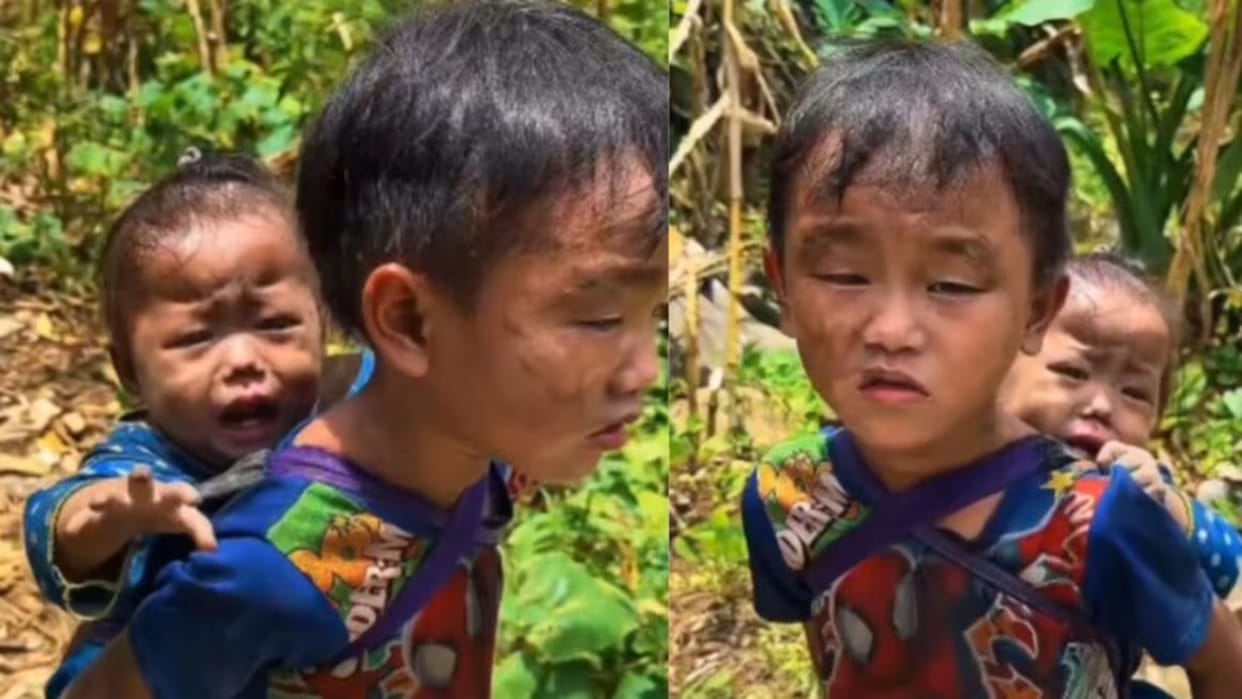 nepal flood little boy carries sister searching parents