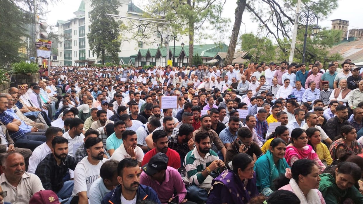 Electricity board employees rally at Chaura Maidan demanding the restoration of the old pension scheme; raise