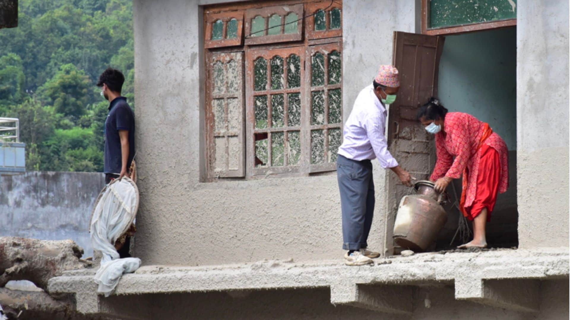14 dead and 200 homes destroyed in Devighat during the Nepal tragedy; blood seeping from the rubble.