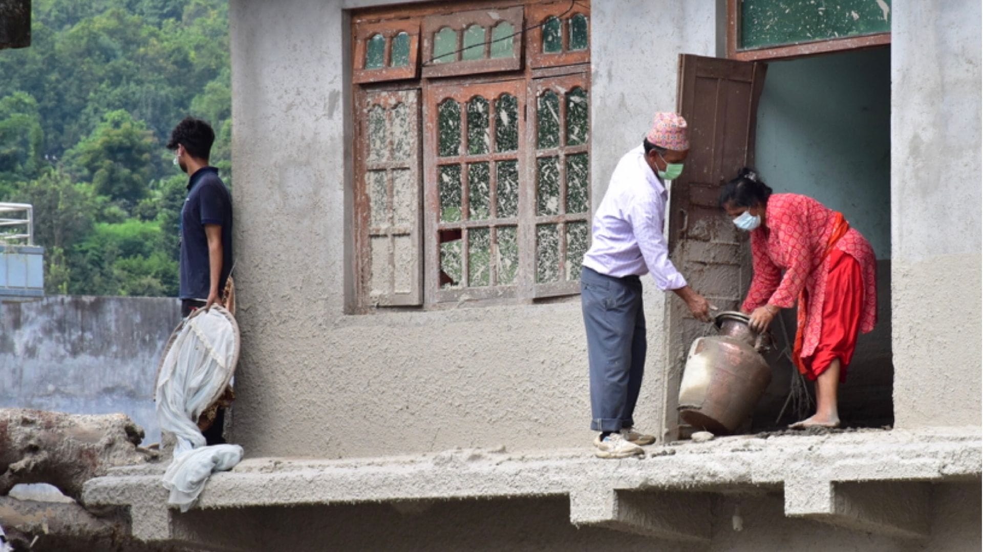 14 dead and 200 homes destroyed in Devighat during the Nepal tragedy; blood seeping from the rubble.