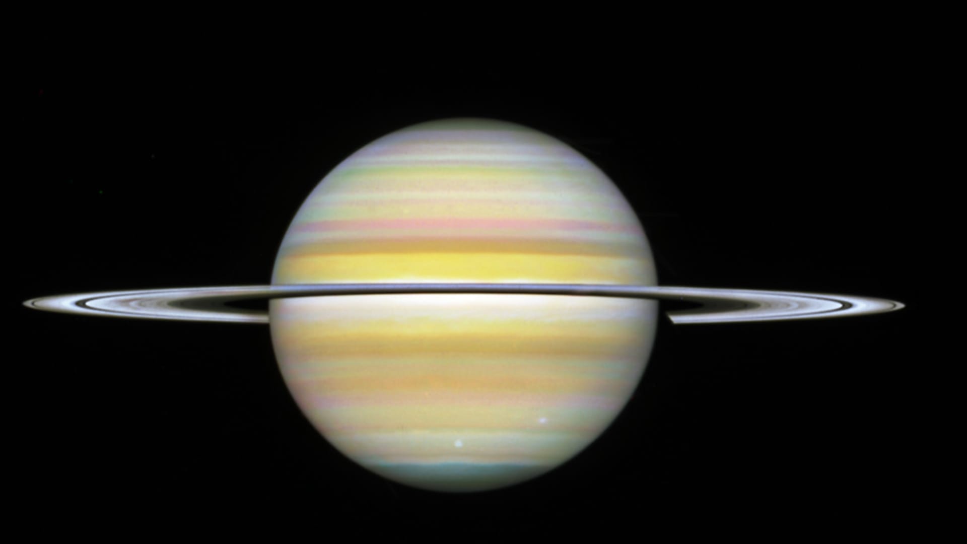 scientists find a huge 10 sided wave pattern swirling in clouds over saturns south pole