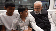 PM Modi Metro Ride What Did the Child Whisper to Narendra Modi Watch Viral Video