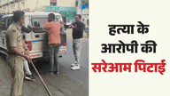 हत्या आरोपी को गाड़ी से बांधकर पीटती दिखी गुजरात पुलिस