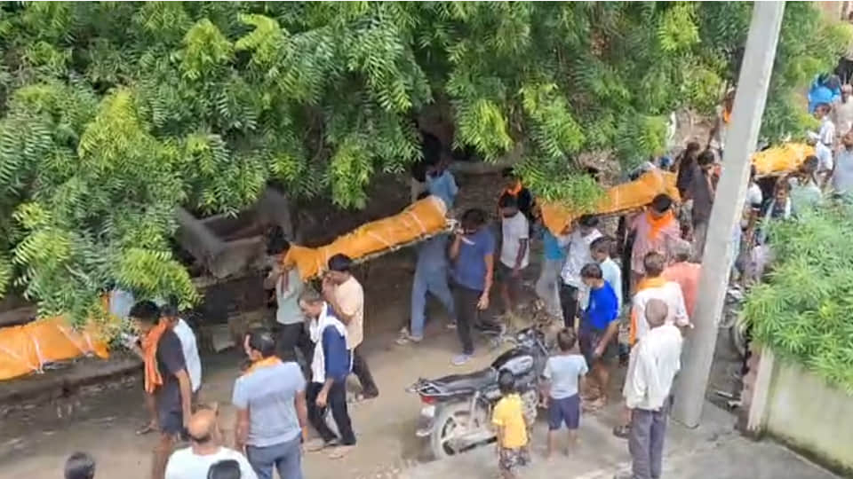 Heart-wrenching: Funeral processions for a father and his three daughters leave from the same courtyard