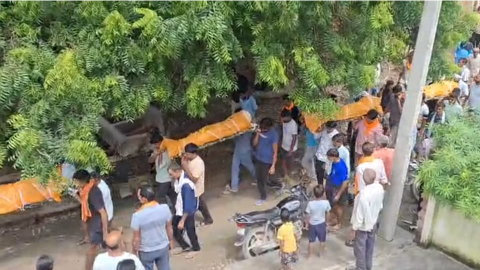 Heart-wrenching: Funeral processions for a father and his three daughters leave from the same courtyard