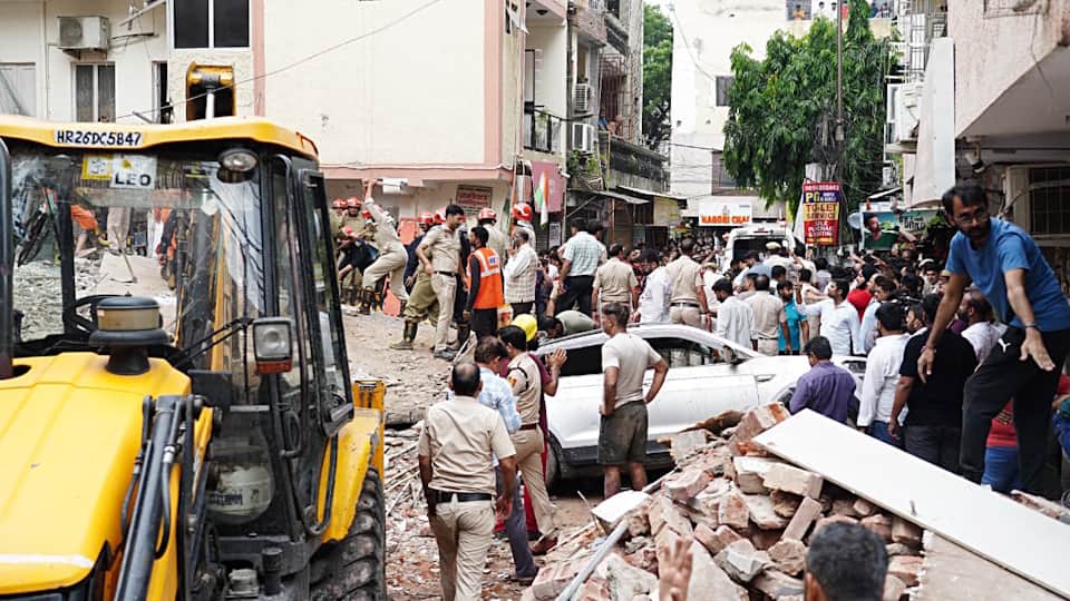 Delhi Building collapses When pulled out child holding book man trapped debris recorded video and sent it out
