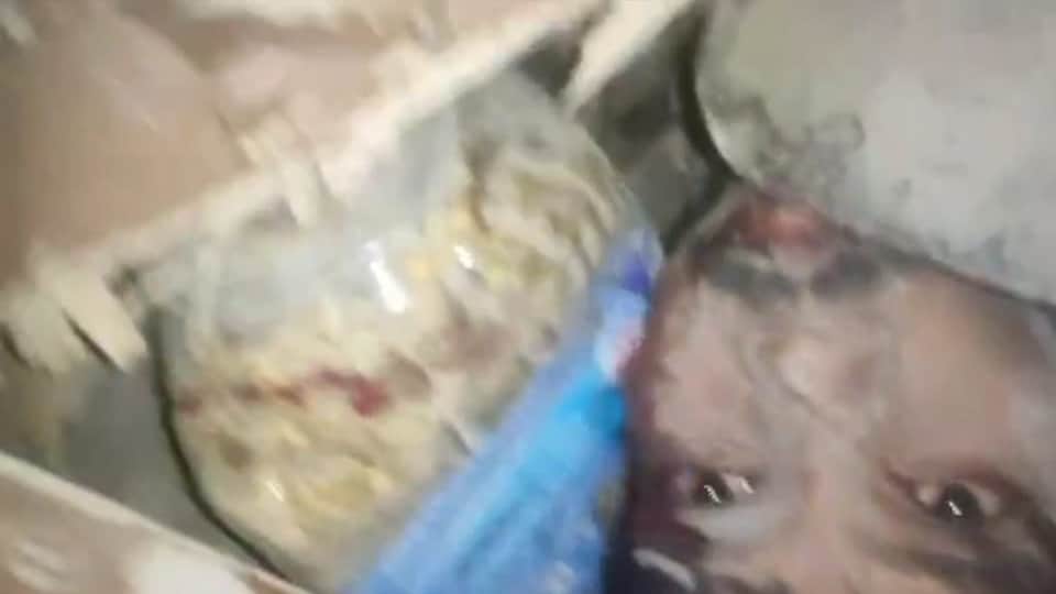 Delhi Building collapses When pulled out child holding book man trapped debris recorded video and sent it out