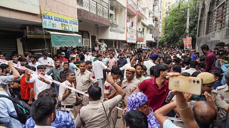 Delhi Building collapses When pulled out child holding book man trapped debris recorded video and sent it out