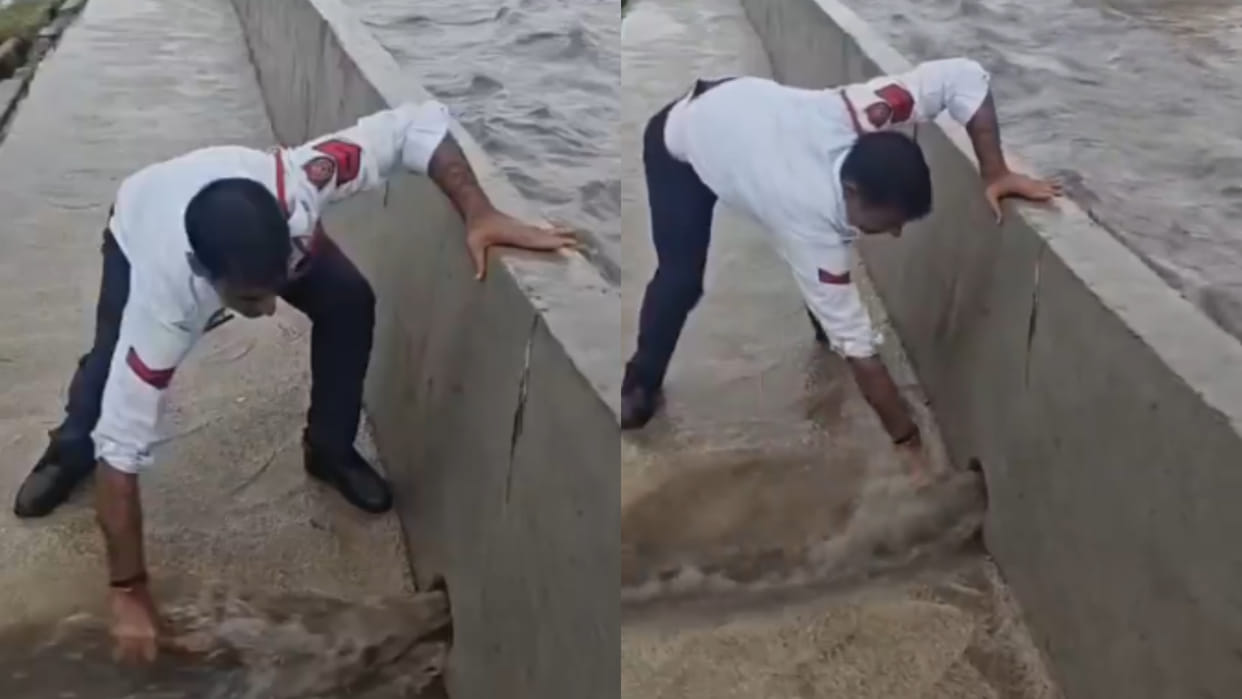Gurugram a traffic cop clears blocked waterlogged road amid heavy rainv viral video