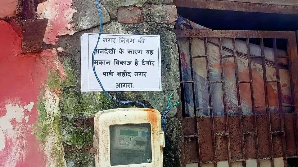 Troubled by overflowing sewers and drains residents put up House for Sale posters in agra