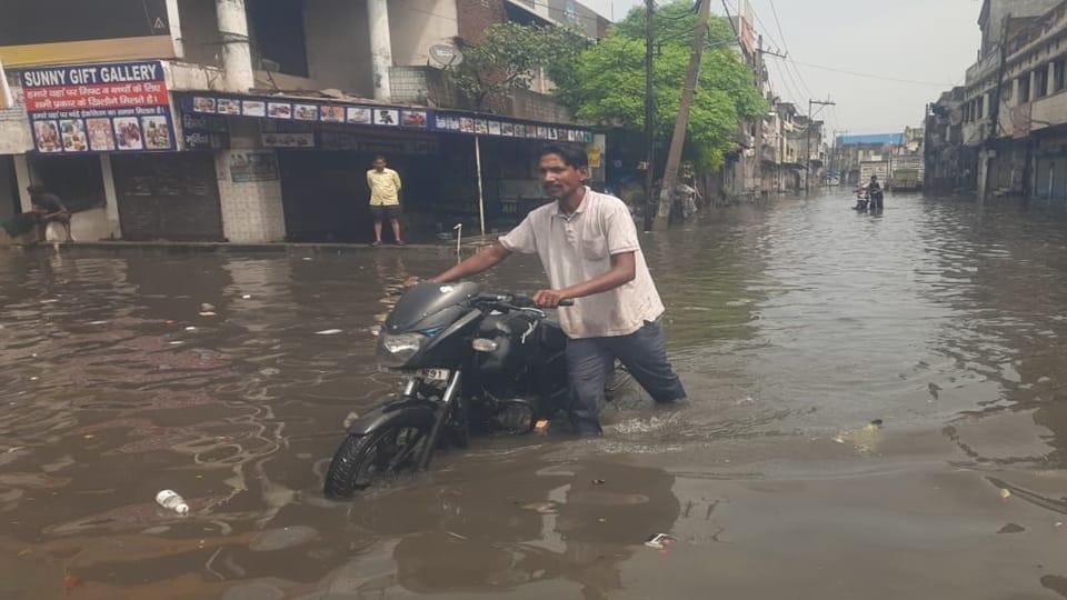Waterlogging in Yamunanagar following heavy rain; electricity poles and trees also fell.