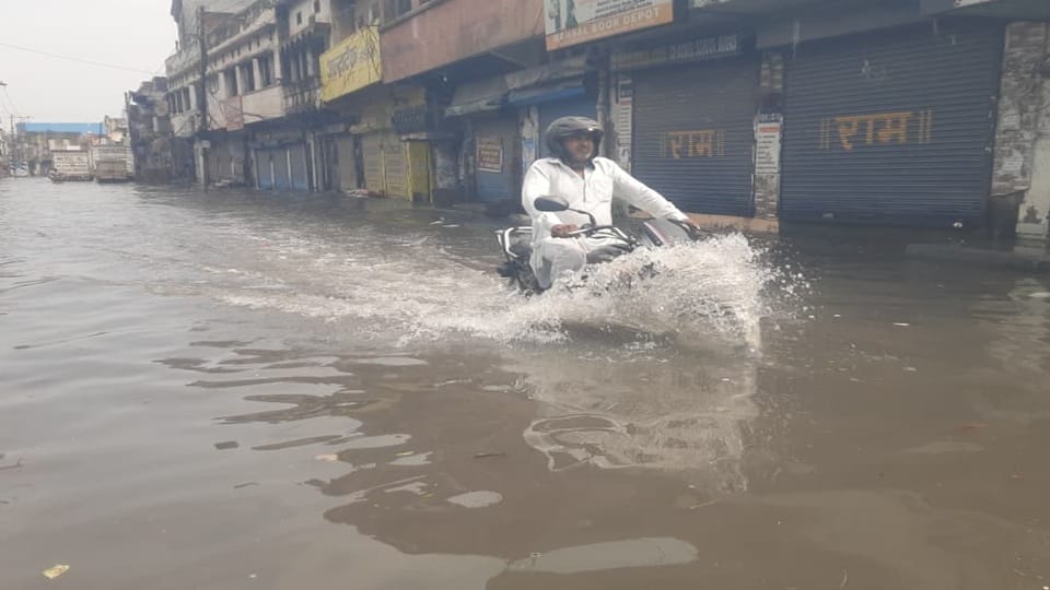 Waterlogging in Yamunanagar following heavy rain; electricity poles and trees also fell.
