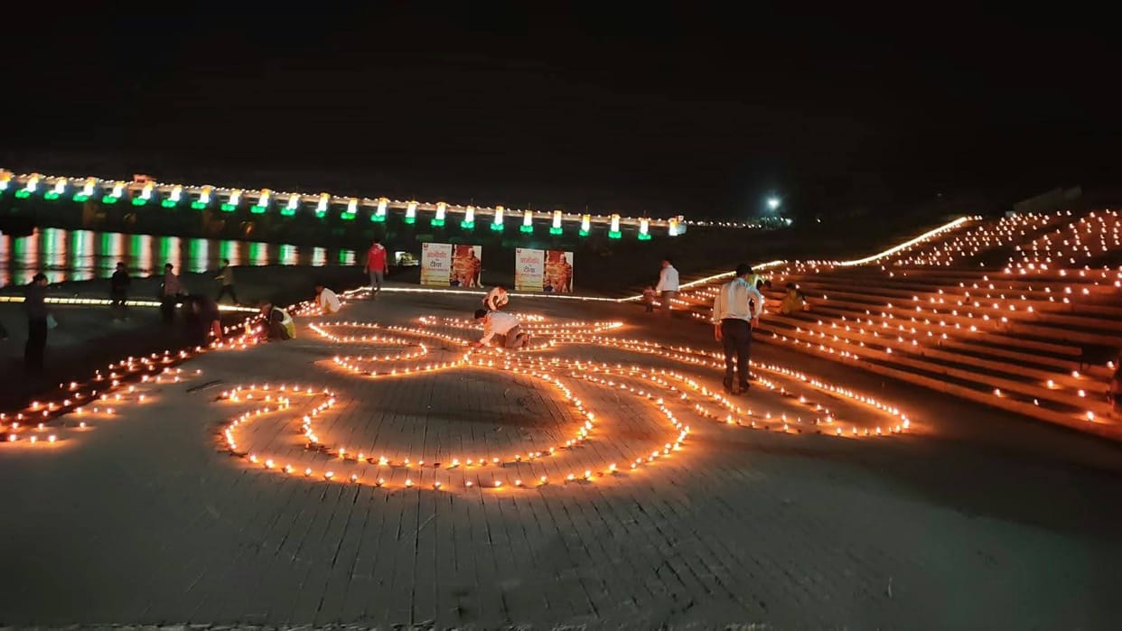 omkareshwar brahmpuri ghat lit up with thousands of diyas om shaped diya narmada aarti