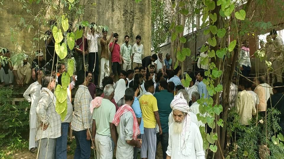 Dispute over carving path through graveyard land locals protest