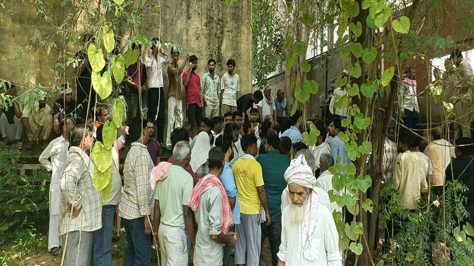Dispute over carving path through graveyard land locals protest