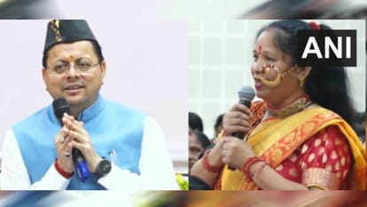 सीए्म धामी के सामने गीत सुनाती महिला
