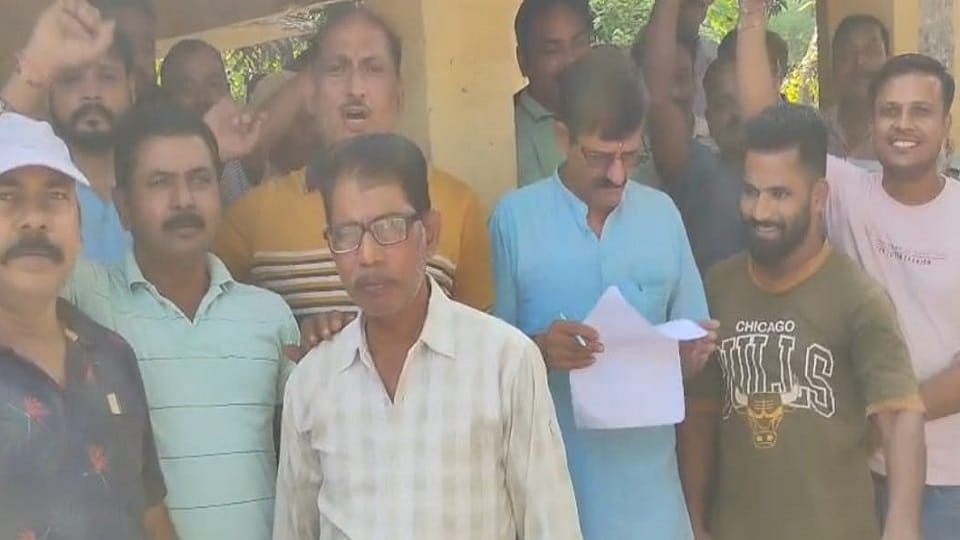 Sugar mill workers create an uproar; stage a sit-in at the main gate over non-payment of wages