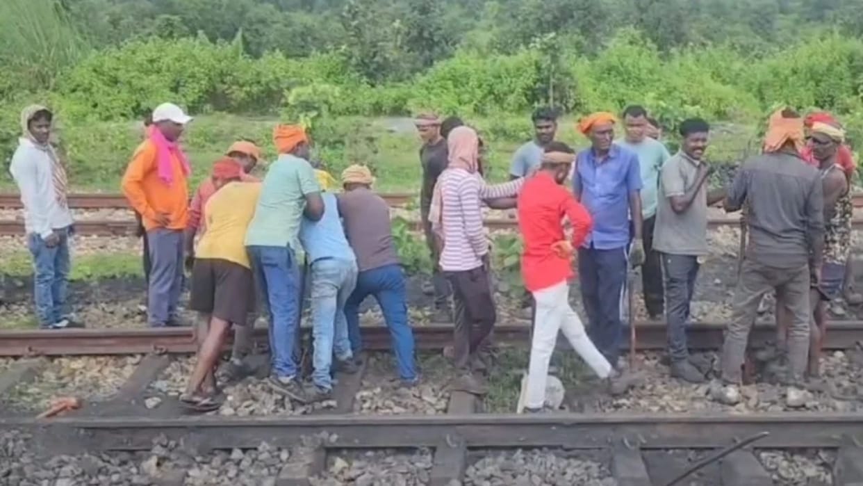 DRM inspects site after goods train derails in Dhanbad; track repair work underway.