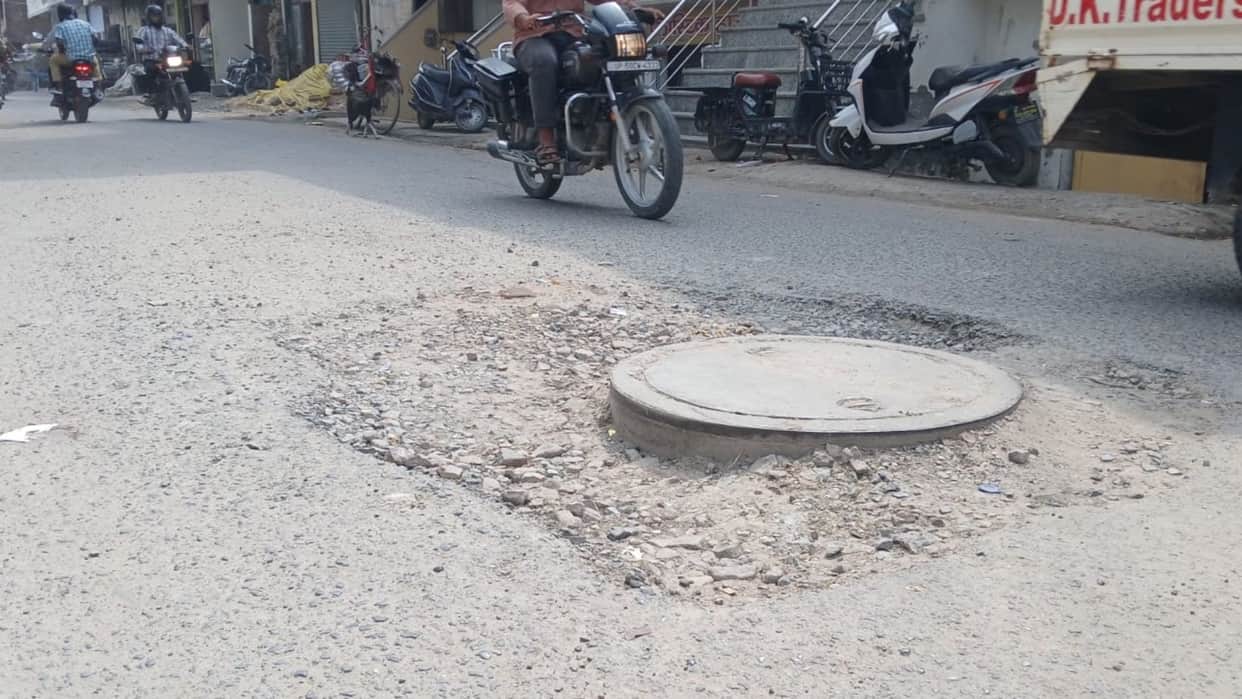 drains higher than road in some places while sewer covers sit above road level in others at Azamgarh