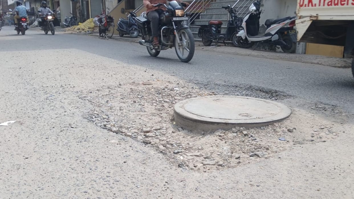 drains higher than road in some places while sewer covers sit above road level in others at Azamgarh