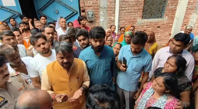 Kanpur murder case Uproar over shopkeepers killing MLA assures family provides financial aid of one lakh