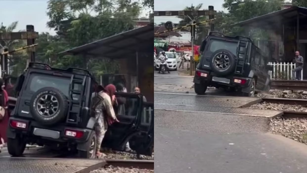 kerala car stuck on railway track as train approaches viral video