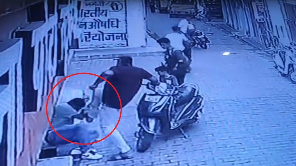 Railway employee runs scooter over a man beats him with kicks and punches and attempts to strangle him in Jhan