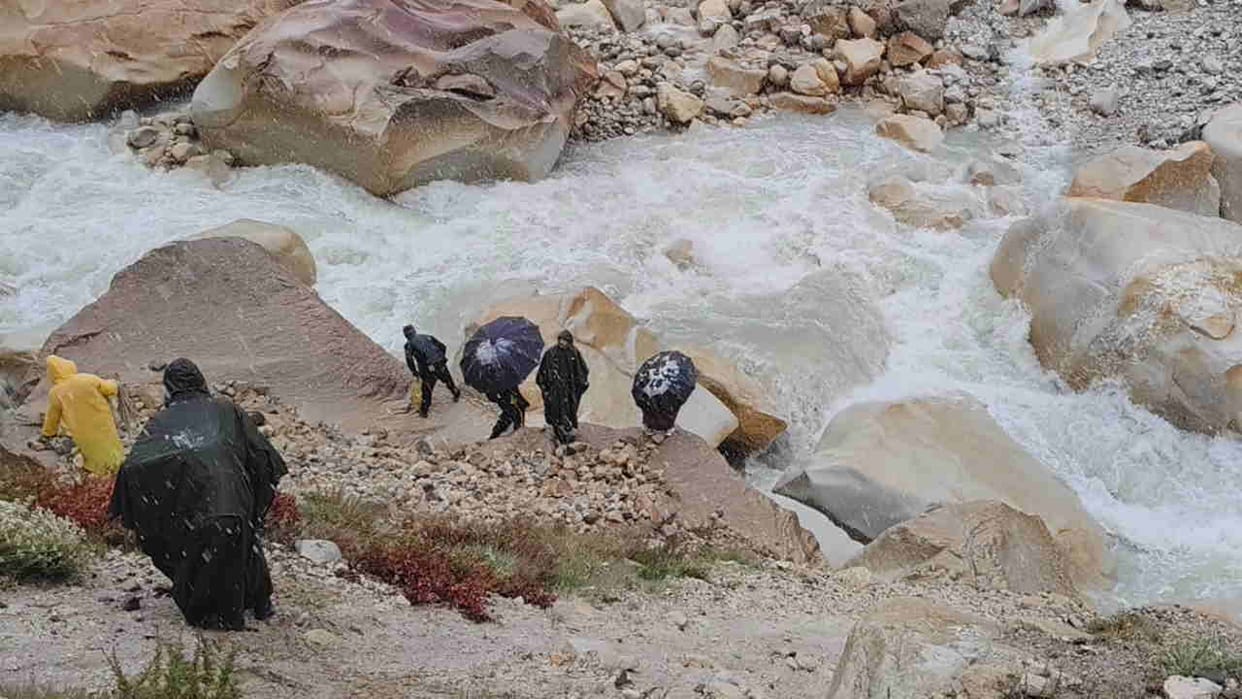 Gomukh trek accident maharashtra pilgrim swept away in river rescue operation halted due to snowfall