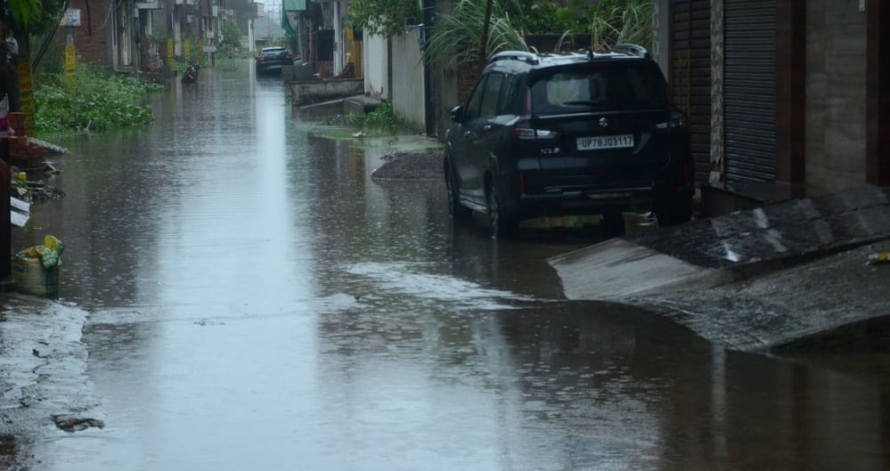 Kanpur Life fueled by water 55 year rainfall record broken drains and roads overflowing water enters homes