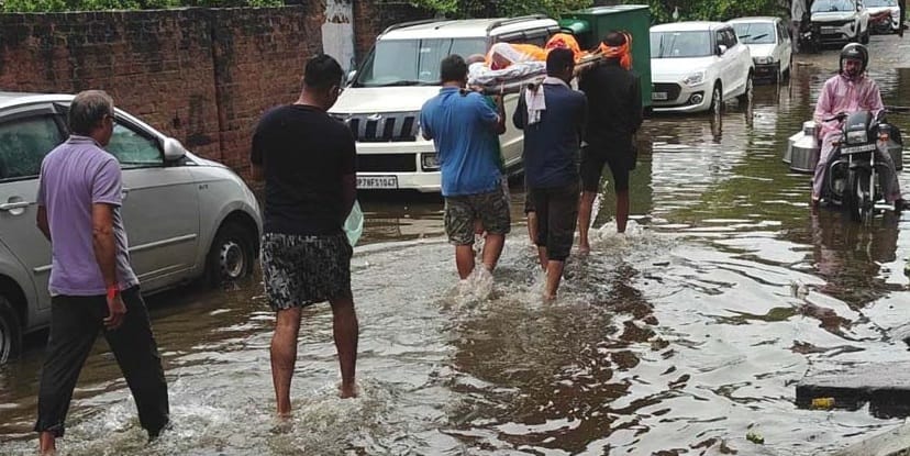 Kanpur Life fueled by water 55 year rainfall record broken drains and roads overflowing water enters homes