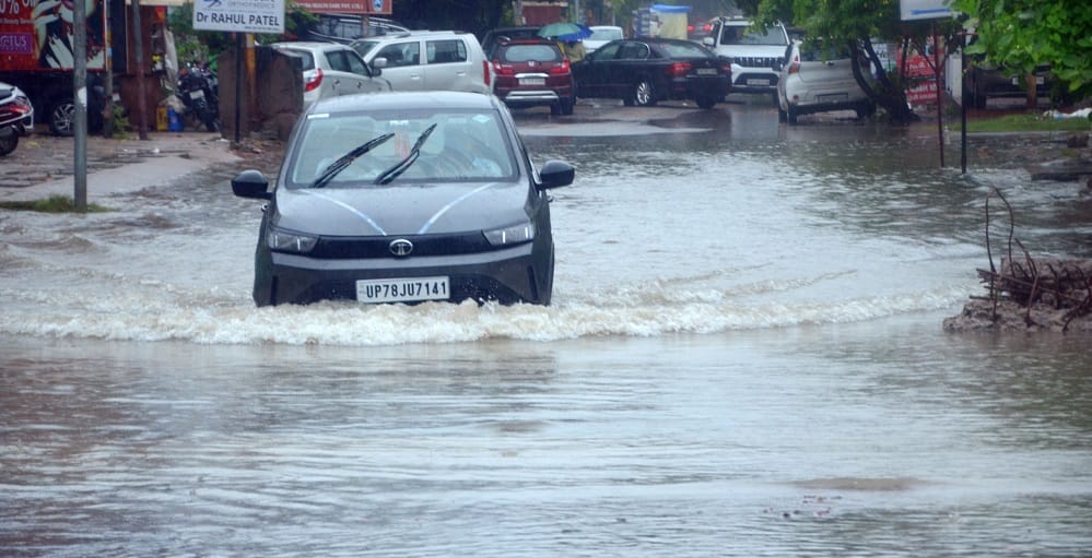 Kanpur Life fueled by water 55 year rainfall record broken drains and roads overflowing water enters homes